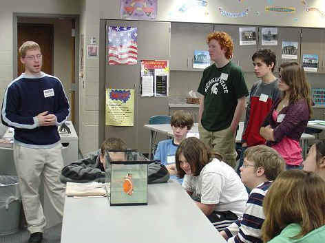 Anthony Chippewa talking to students about fish robot